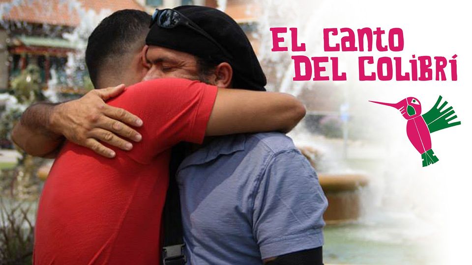 Two Latino males hugging and the title "El Canto del Colibri"